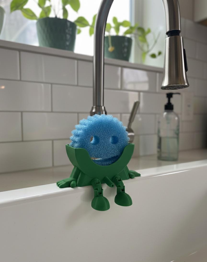 Sitting Sponge Holder for Scrub Daddy® | 3D Printed Kitchen Sink Caddy | Fun Sponge Drainer with Dangling Legs | Eco-Friendly Kitchen Decor
